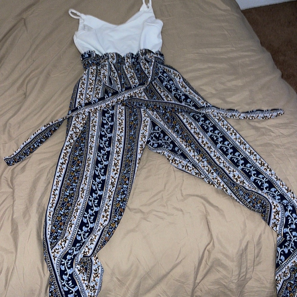 Cute jumpsuit! Worn a few times but in great condition!